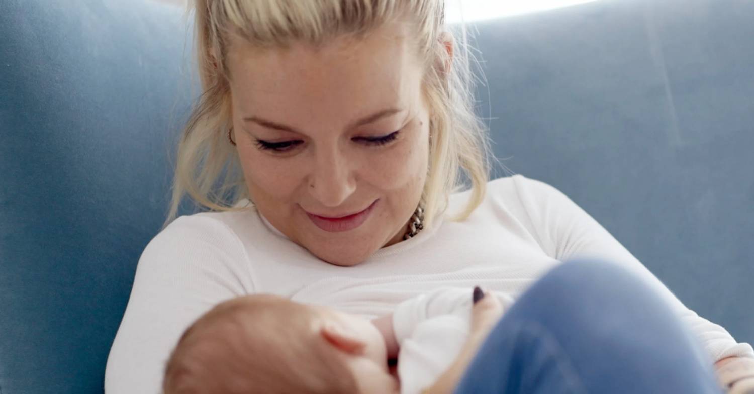 Sheridan Smith cradles her baby
