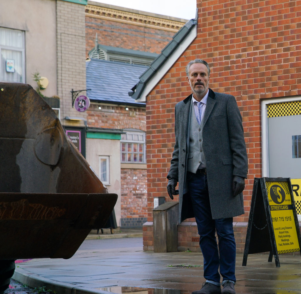 Ray is happy when the bulldozer turns up in Coronation Street