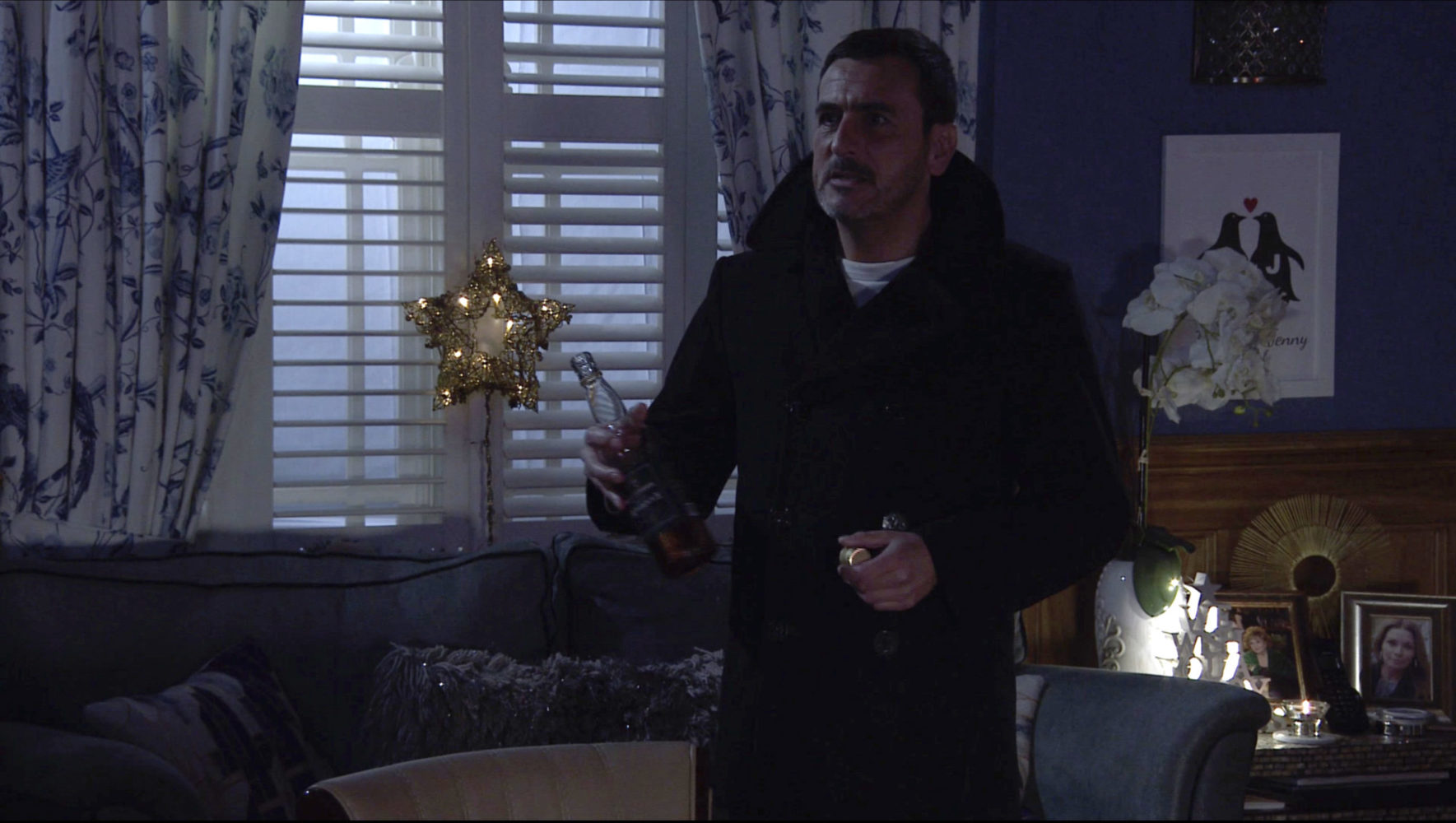 Peter takes a swig of whisky in Coronation Street 