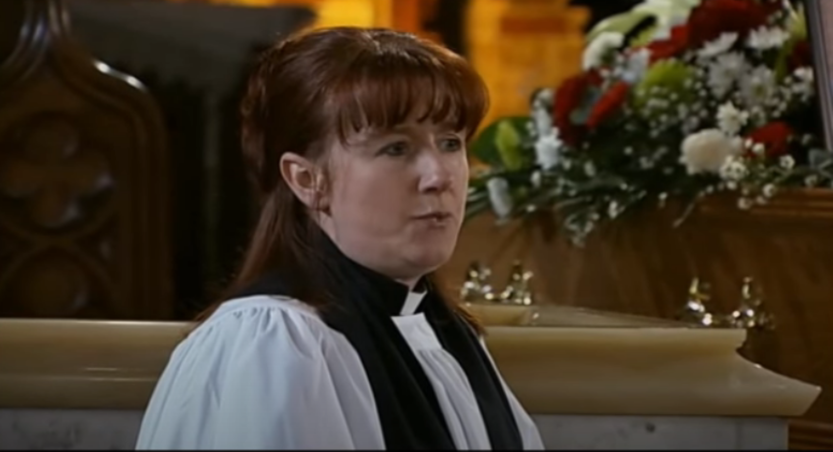 Kate Wood as the vicar at Joe McIntyre's funeral in Coronation Street