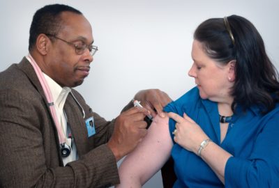 doctor giving someone a vaccinationn