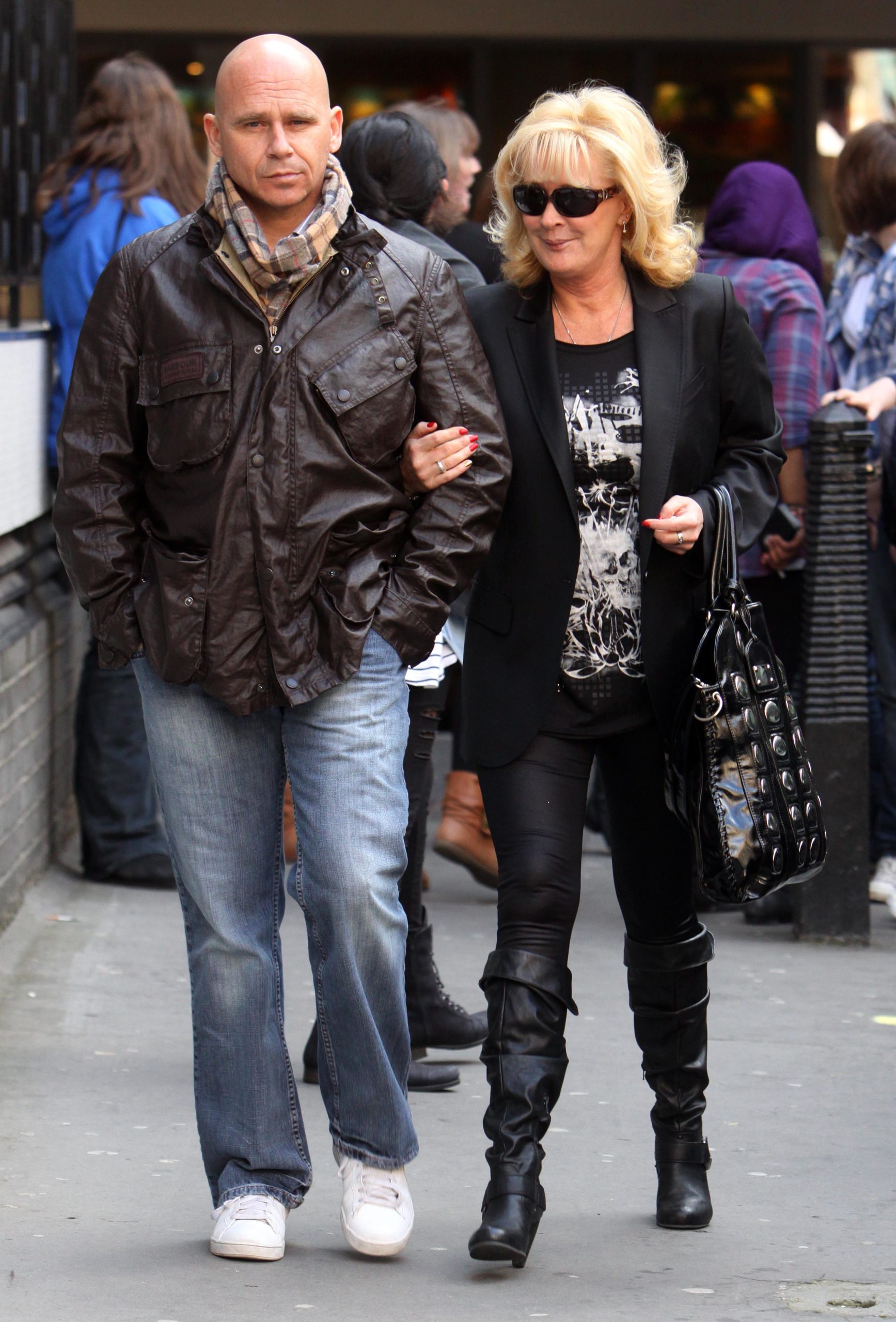 Beverley Callard walks arm in arm with husband Jon