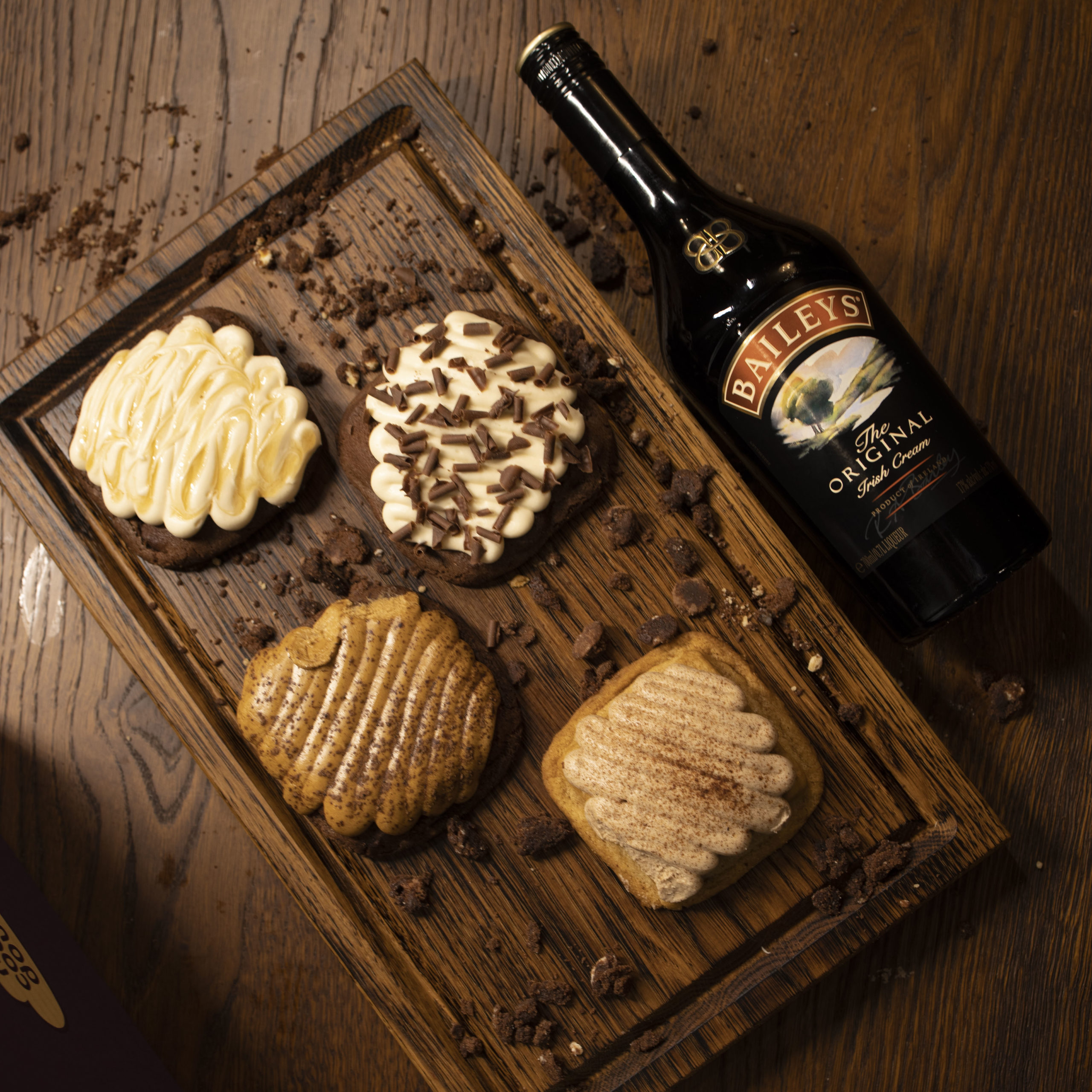 bottle of baileys and some cookie dough squares