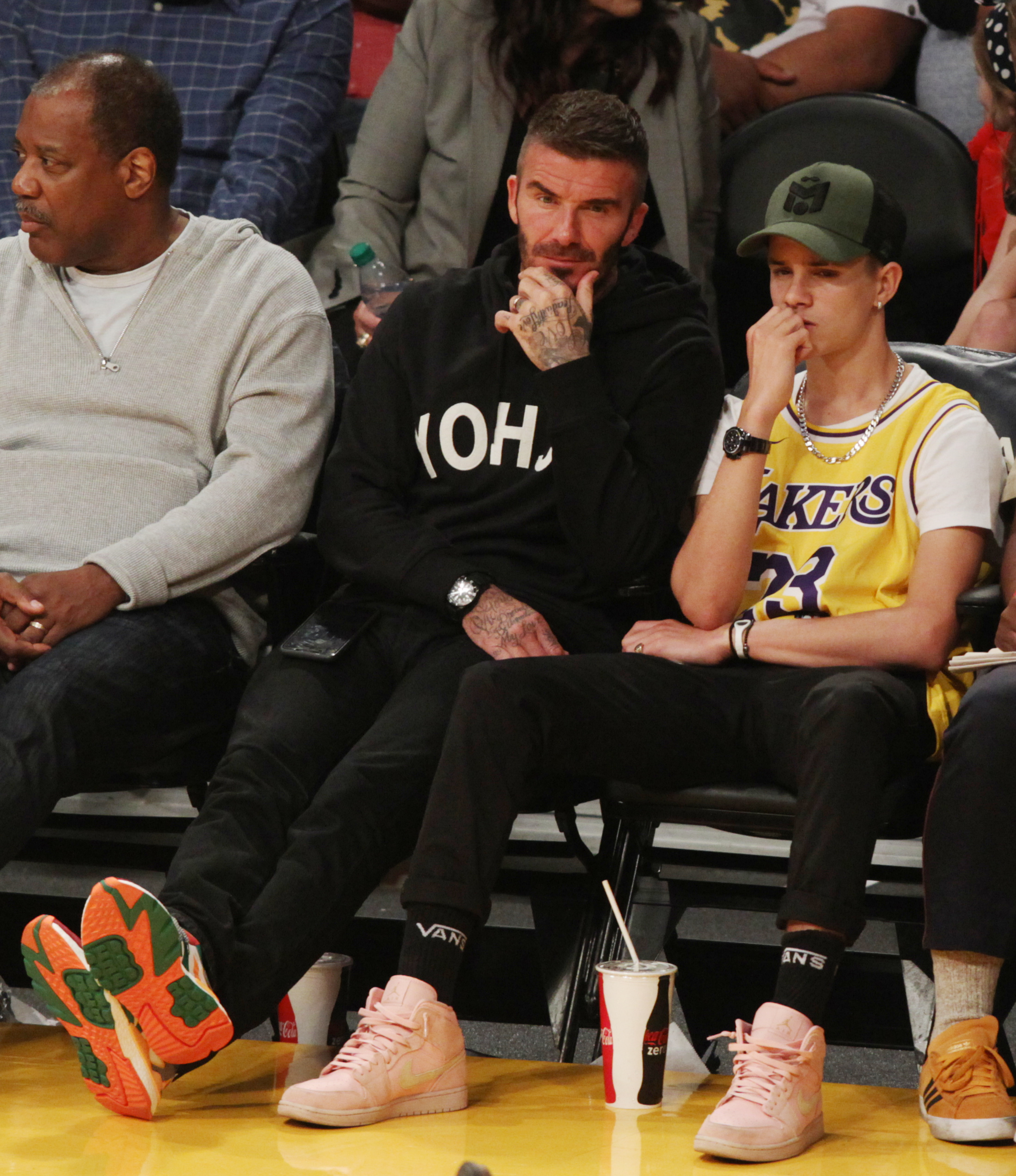 David and Victoria Beckham have four children. David pictured here with son Romeo