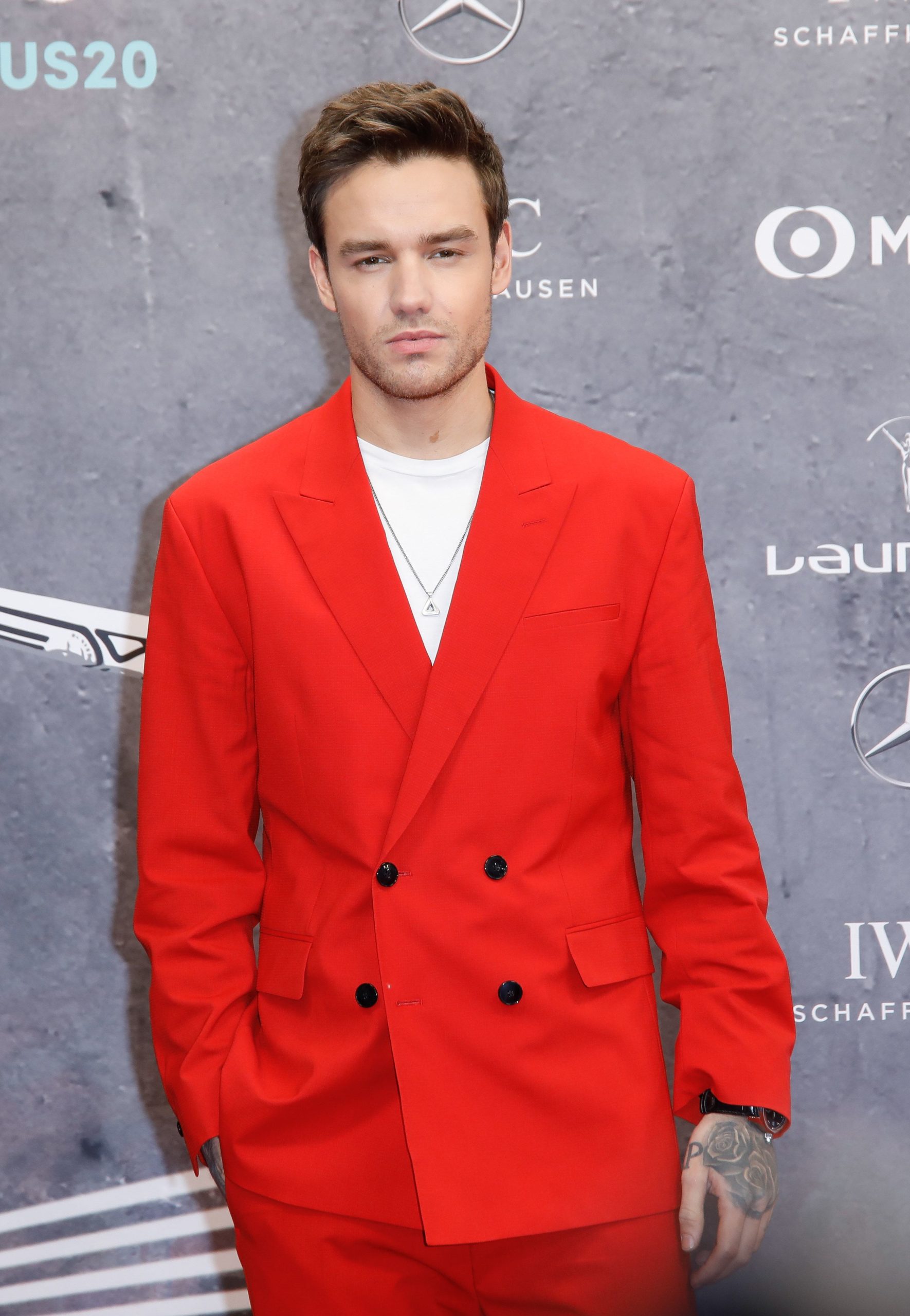Liam payne in a red jacket