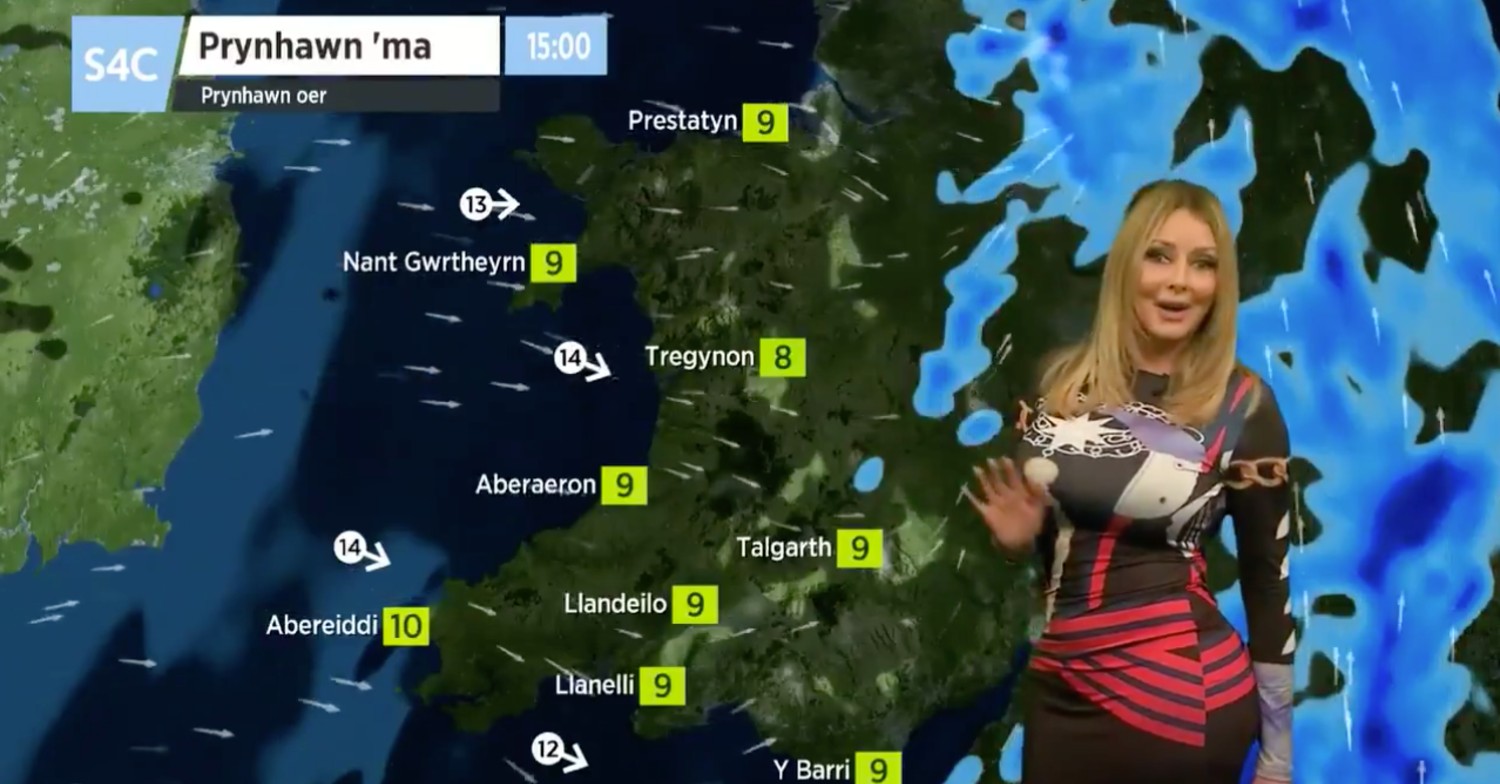 Carol Vorderman presenting the weather in a tight-fitted dress
