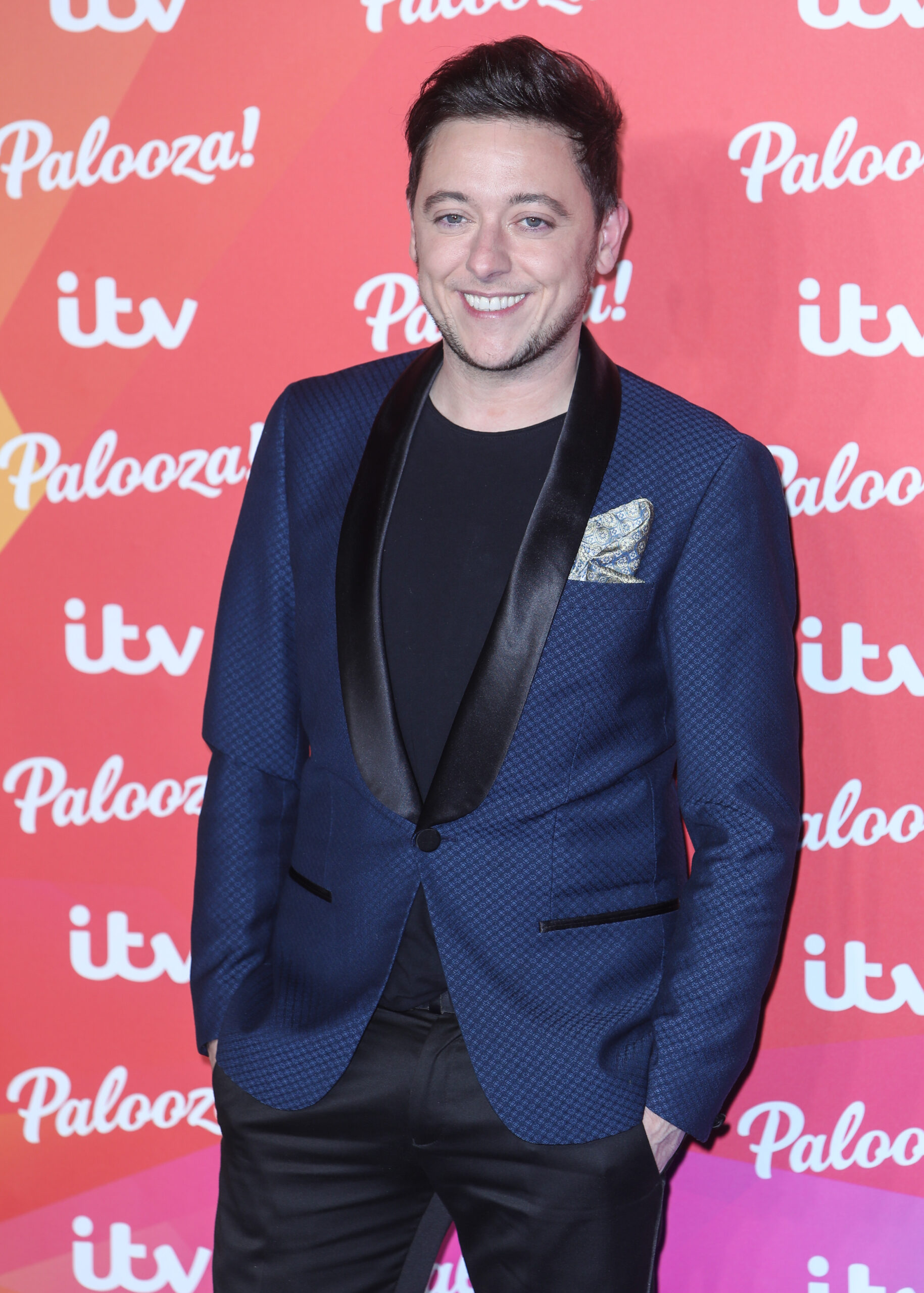 Ash Palmisciano on the red carpet at the ITV Palozza with his hands in his pockets