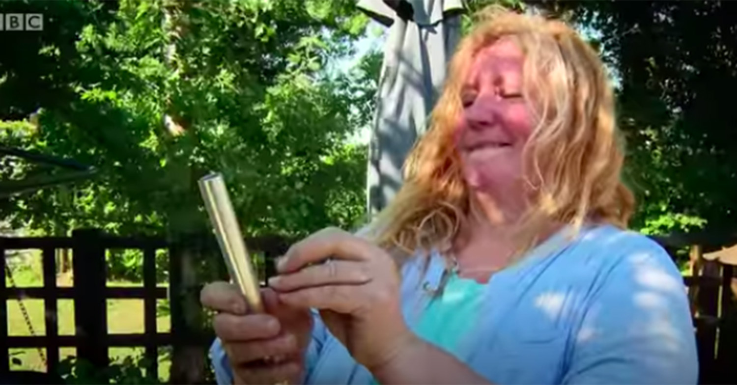 Charlie Dimmock in a blue top in a garden