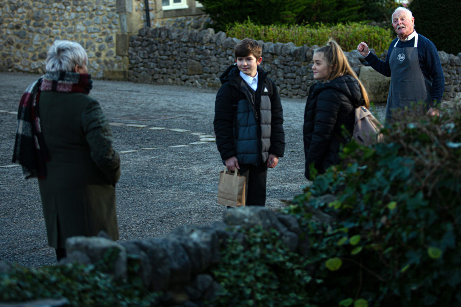 Cathy and Heath in looking at Brenda as Eric stands behind them in Emmerdale