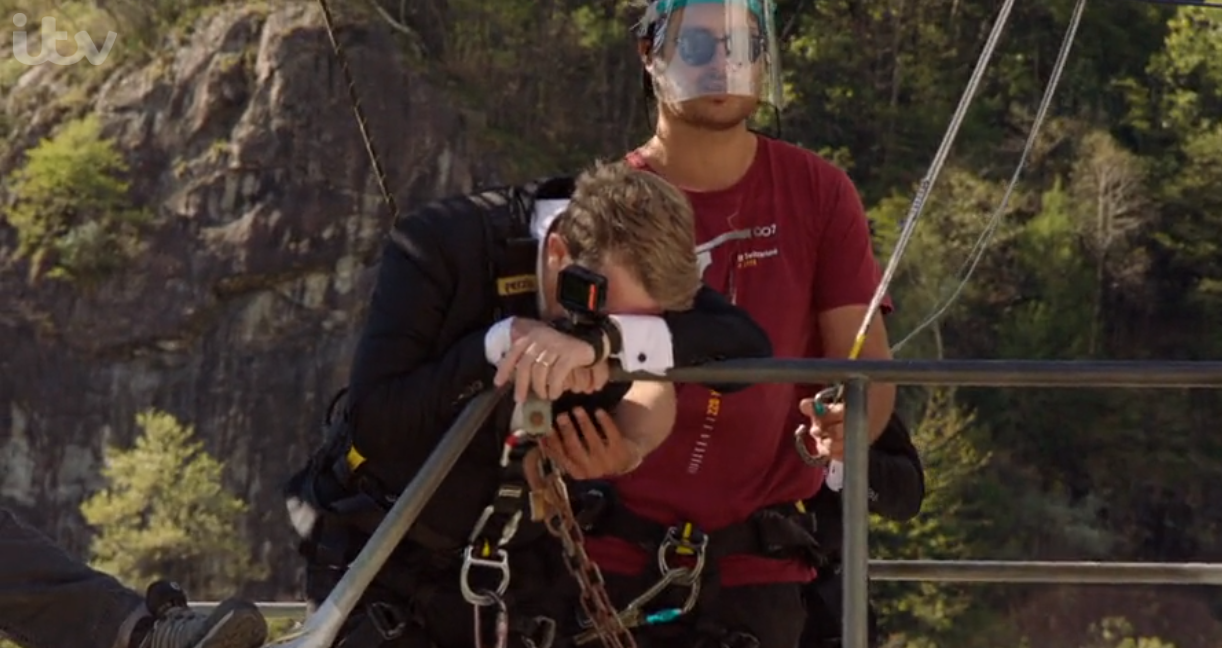 Bradley Walsh covering his face