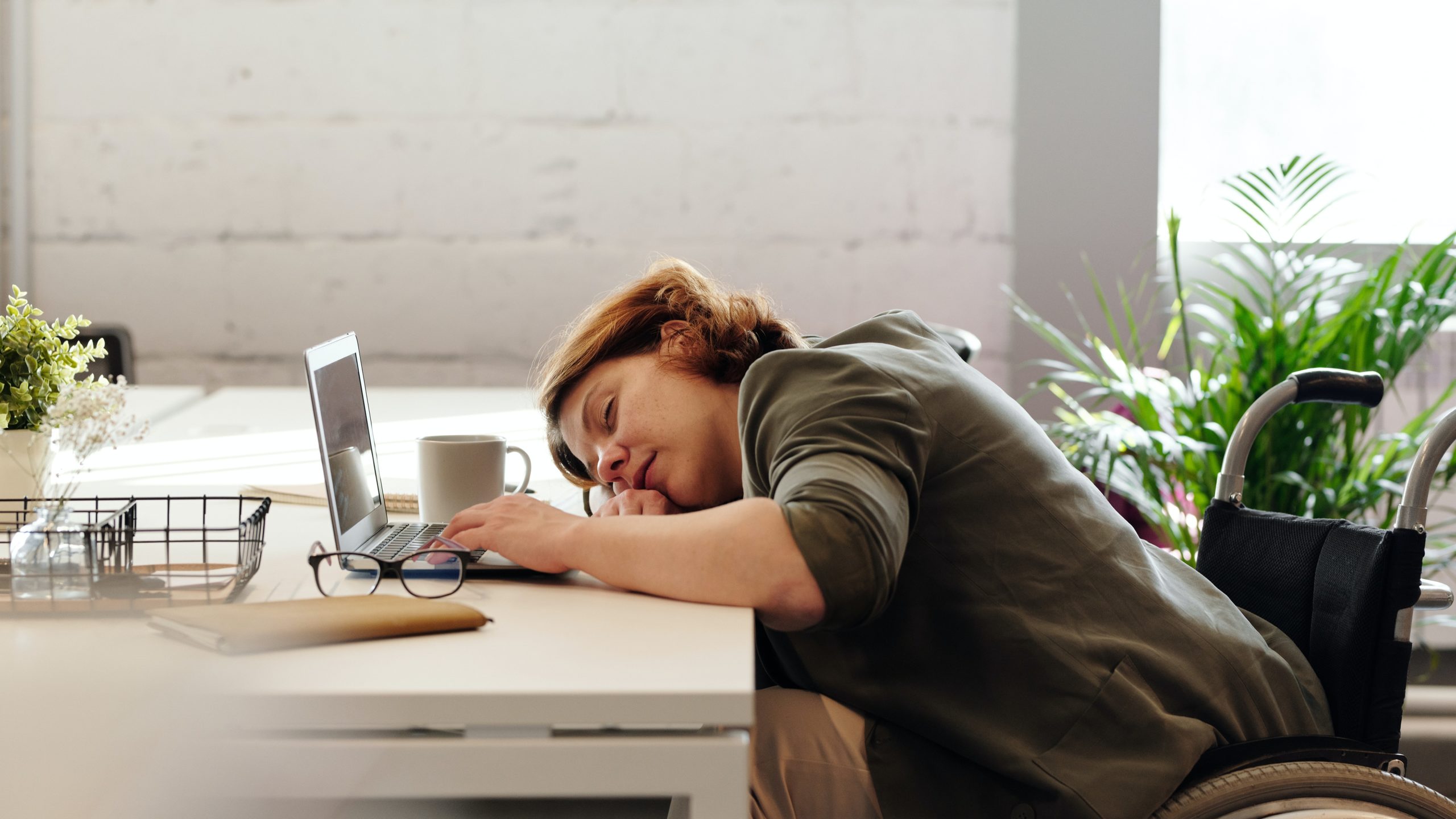 woman asleep at her desk