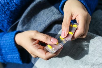 woman with pill packet