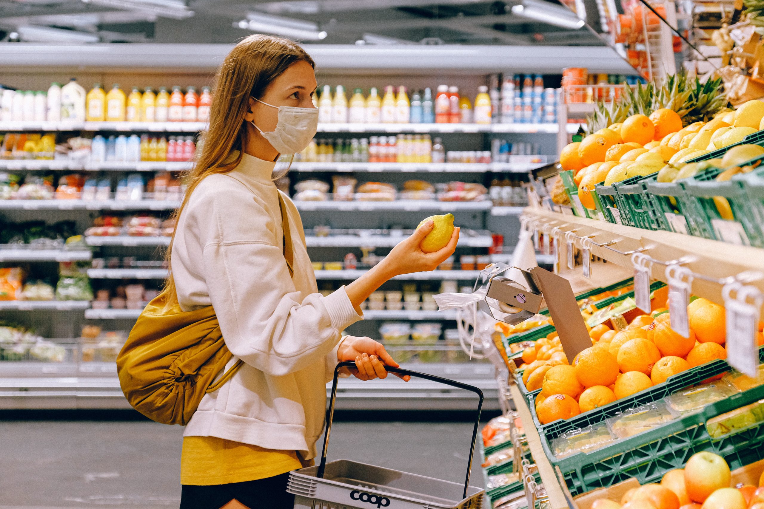 woman wearing a face mask in a shop