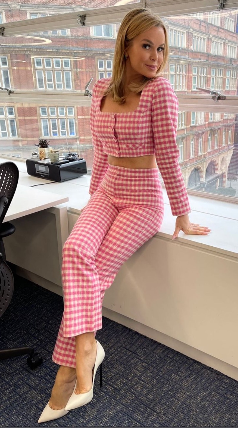 Amanda holden posing in pink outfit