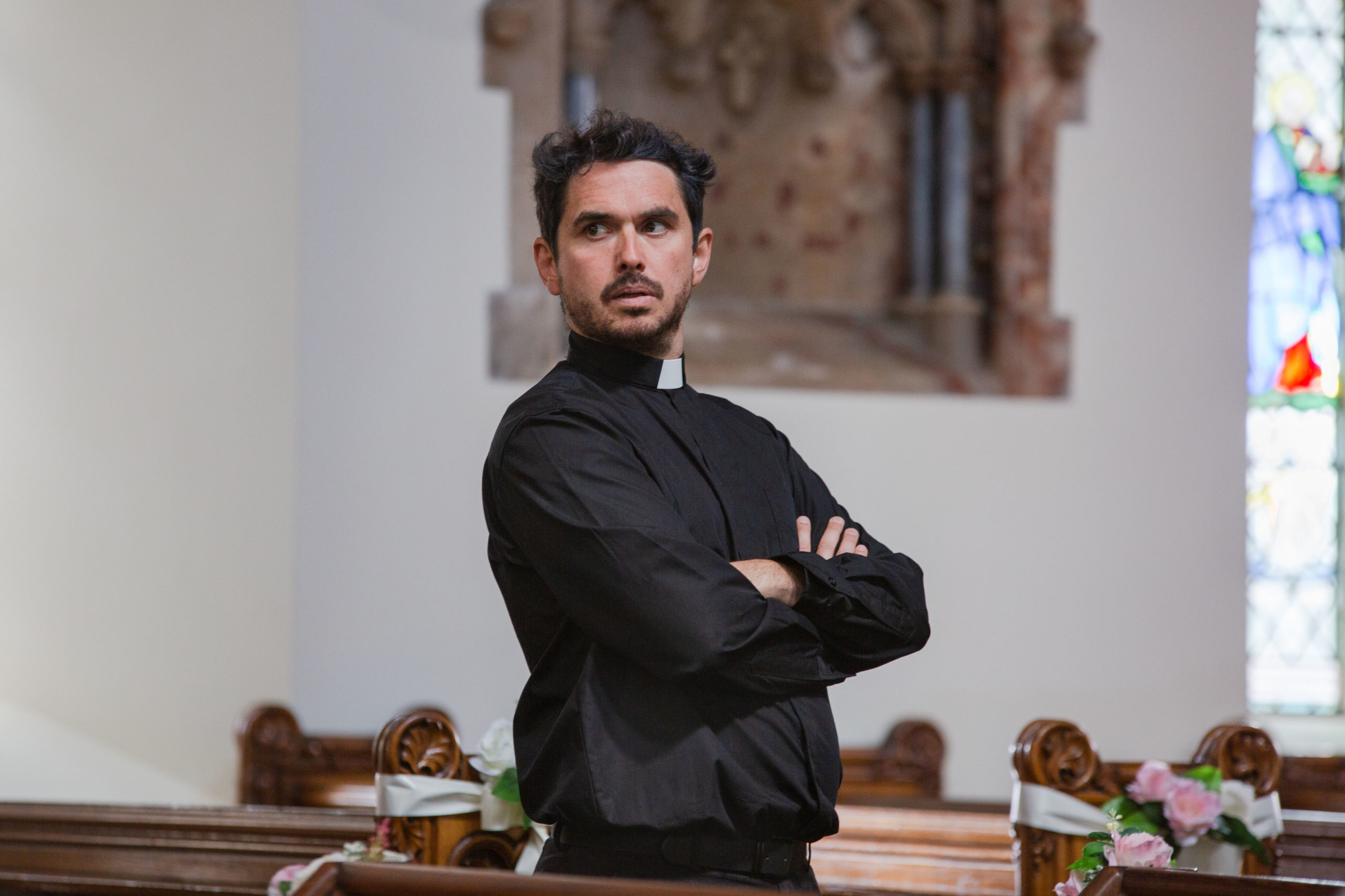 Alex Carter stars as Father Bladen in Moving On series 12