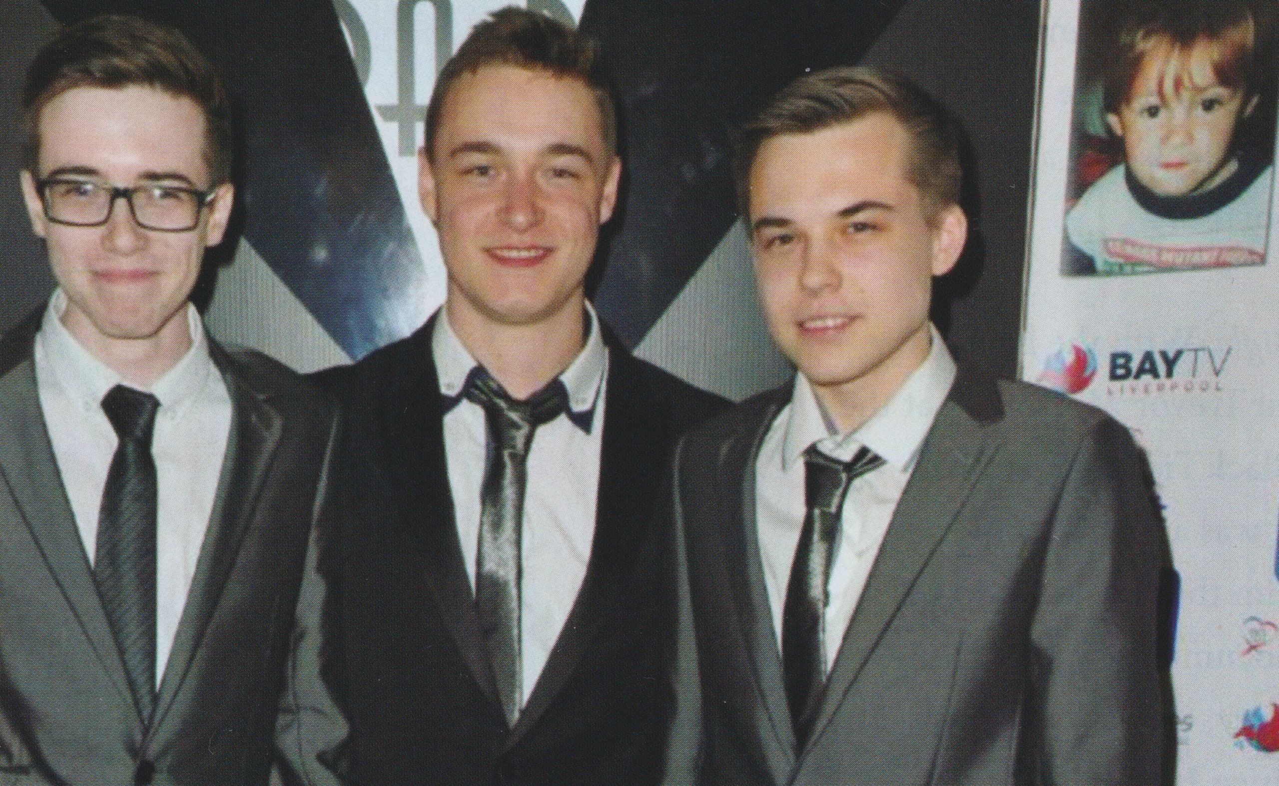 James Bulger's brothers beside a small picture of James (Credit: Denise Bulger / ITN Productions)