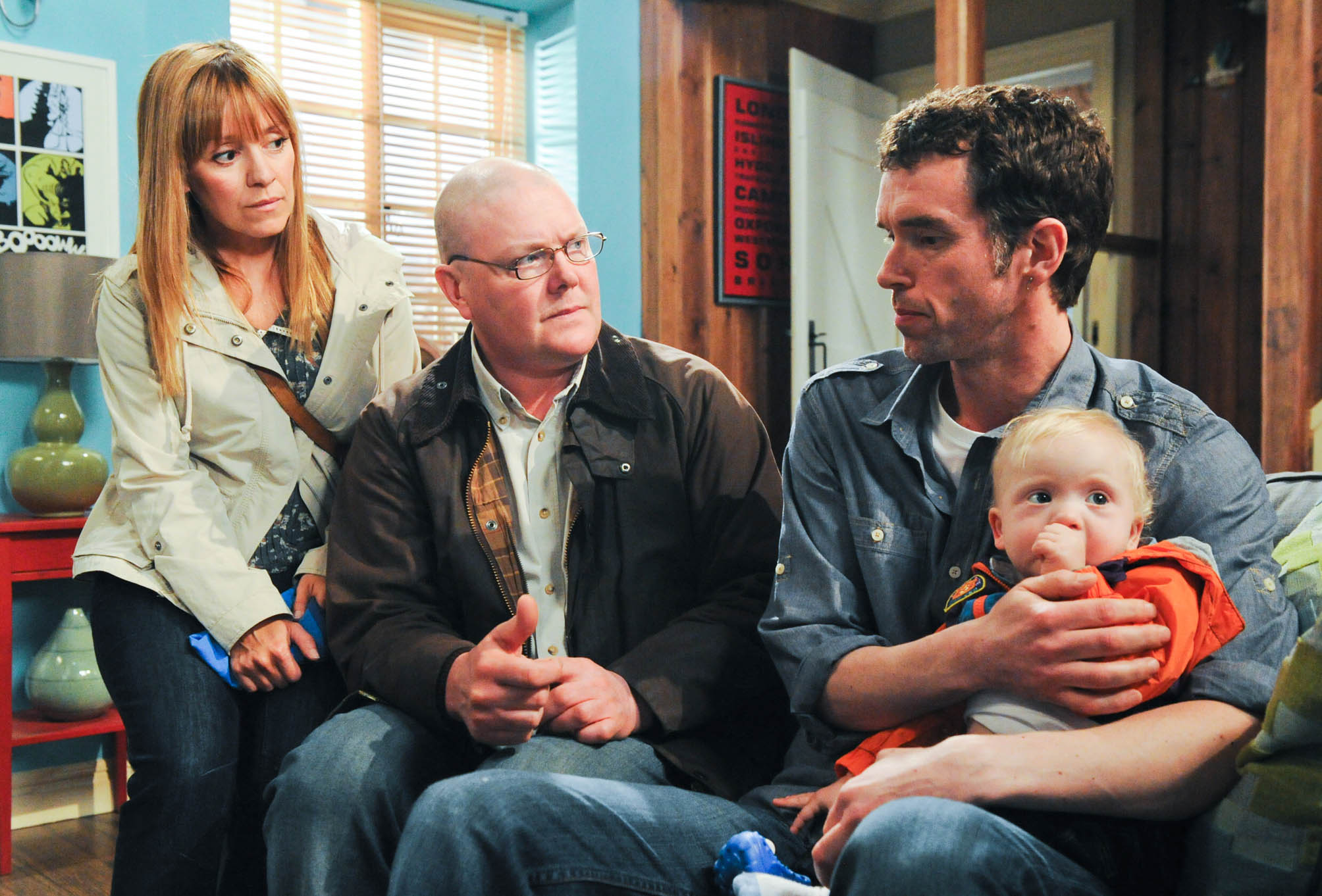 Emmerdale Rhona Paddy Marlon and Leo look worried as they disagree about leaving the village