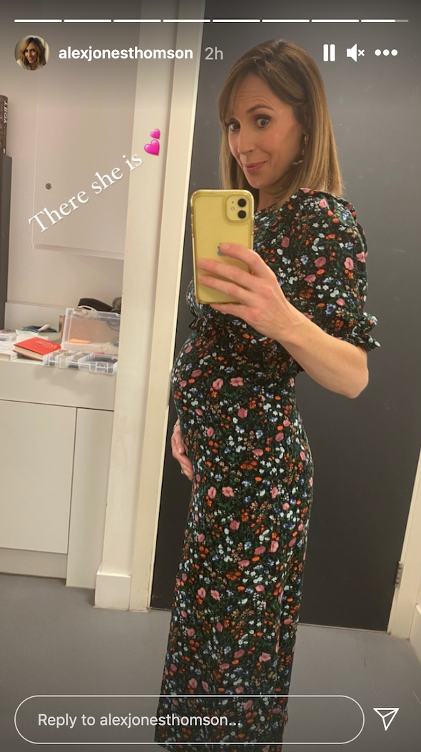 Alex Jones shows off growing baby bump