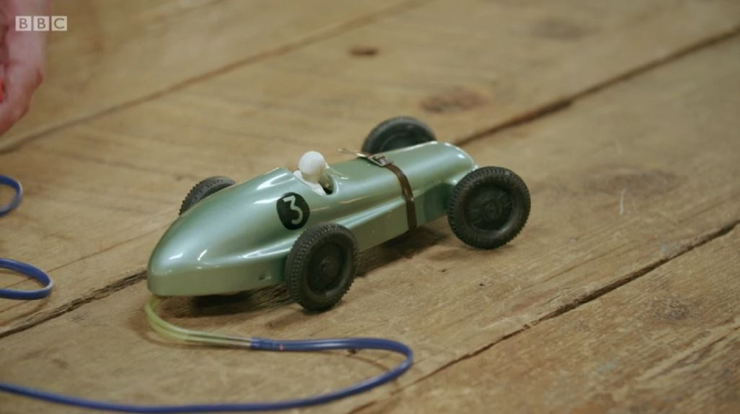 the fixed toy car on the repair shop