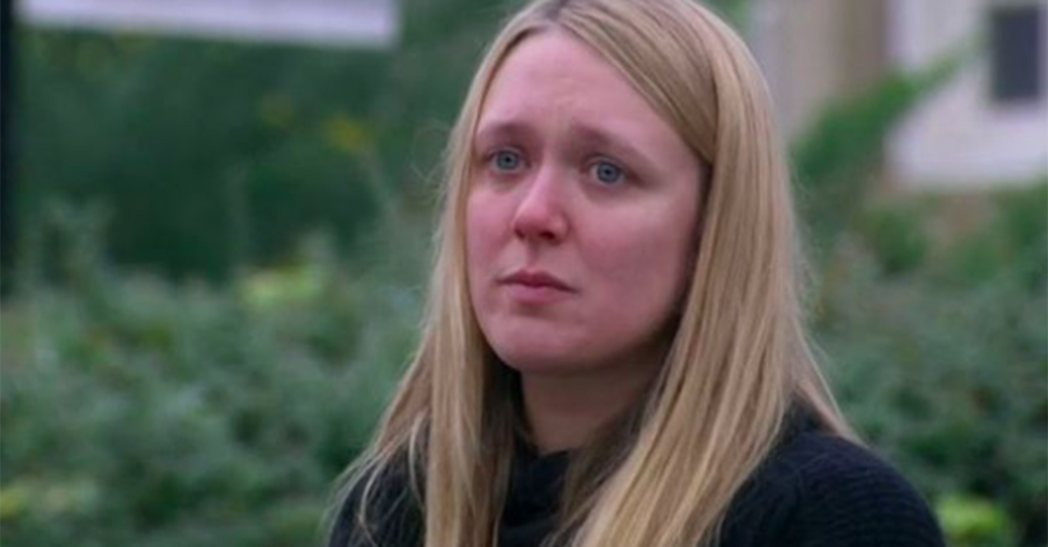 Rebecca White frowns in the square in Emmerdale