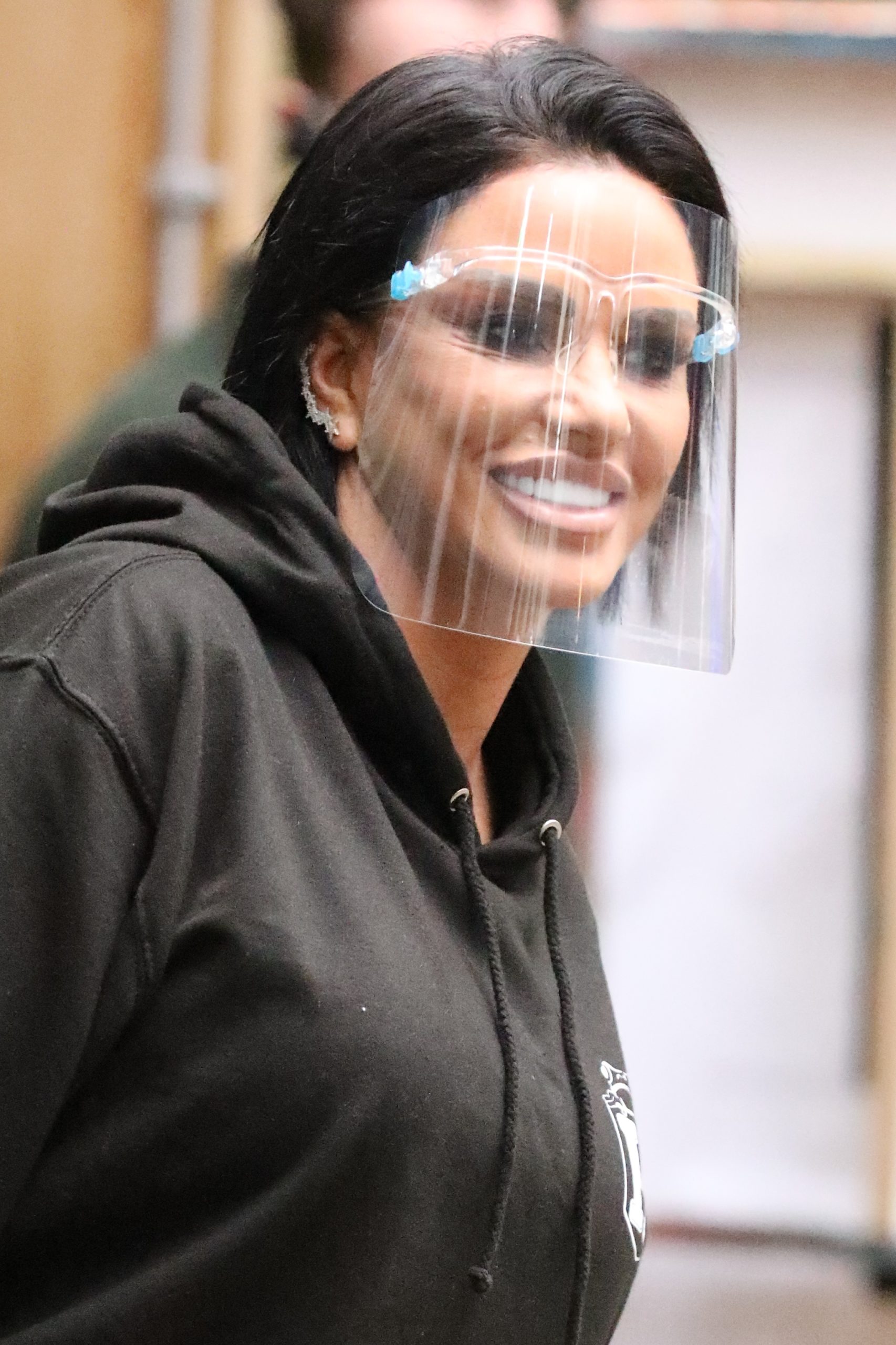 Katie Price wearing a face shield