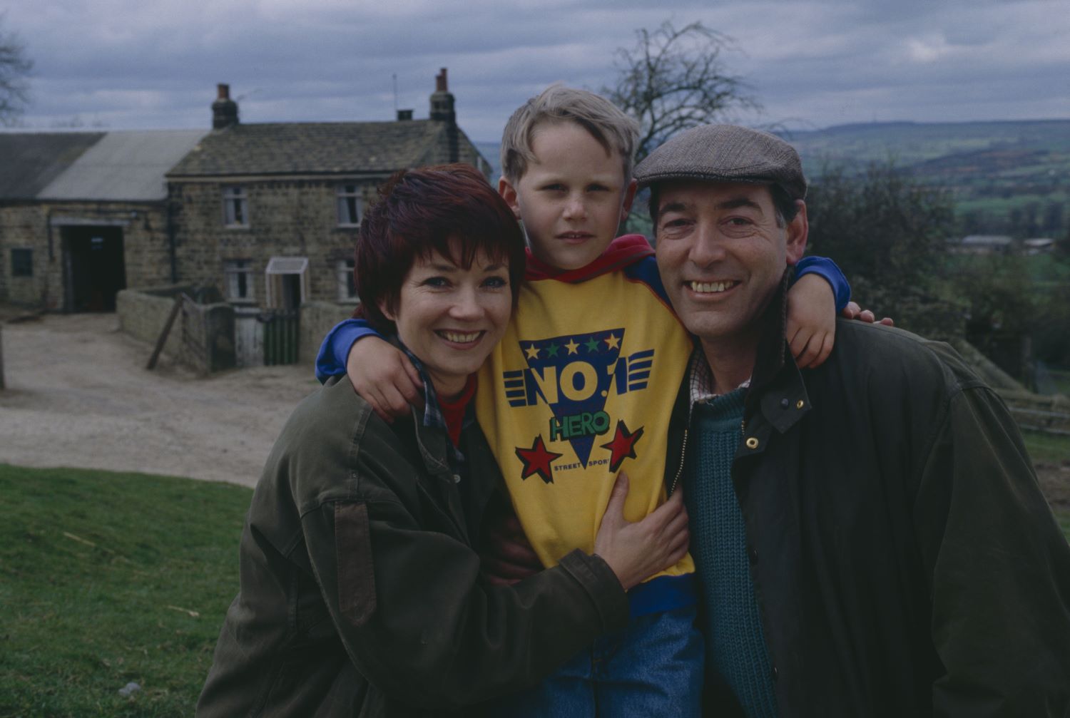Emmerdale Sarah, Robert and Jack Sugden pose for a happy family photo at the farm