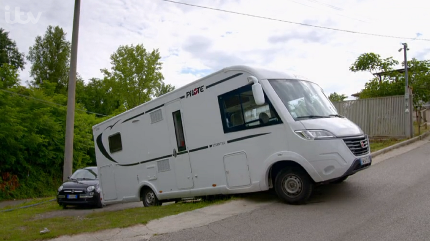 The trio's camper van stuck on a curb