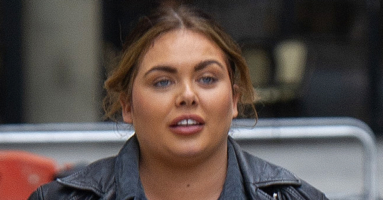 Scarlett Moffatt in a leather jacket looking downcast