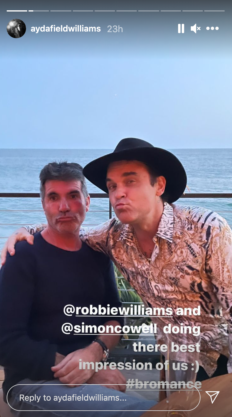 Simon Cowell and Robbie Williams pucker up