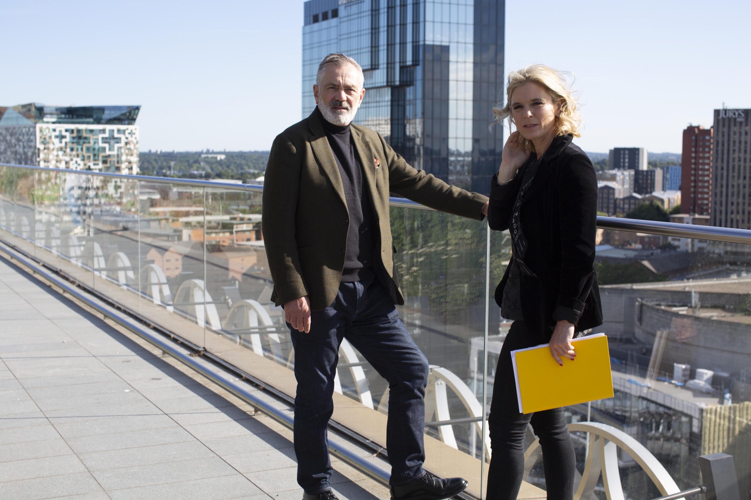 David Wilson and Emilia Fox stand on the terrace for In the Footsteps of Killers on Channel 4