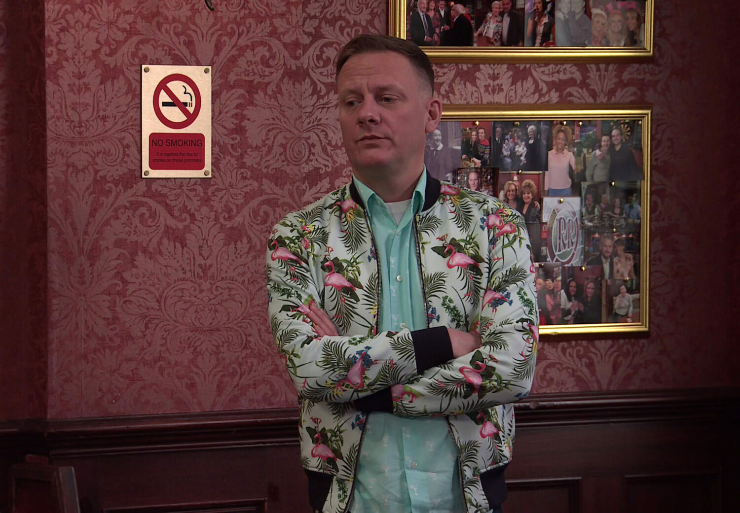 Sean folding his arms looking upset in Coronation Street