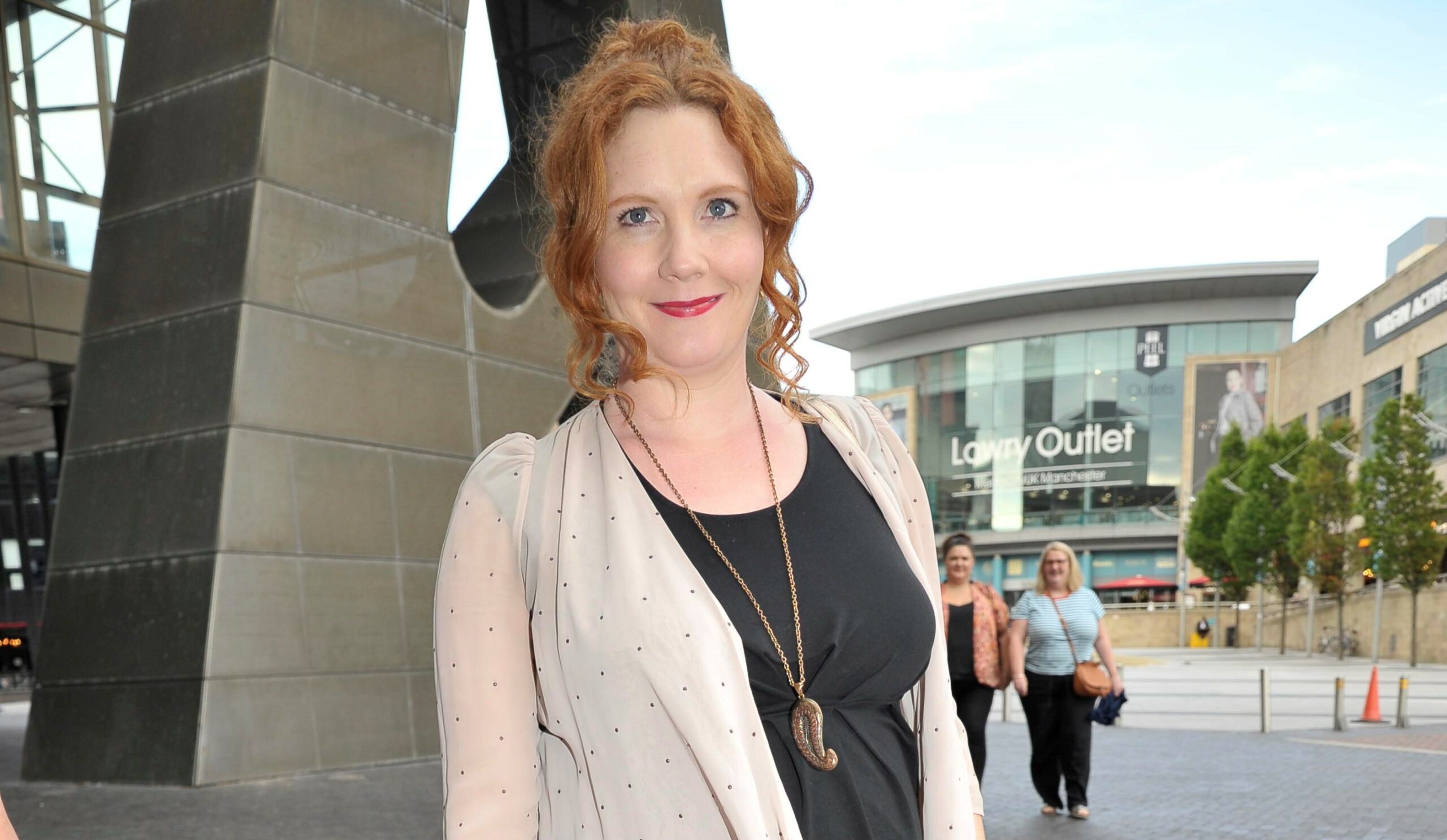 Jennie McAlpine smiles as she's photographed at a press night