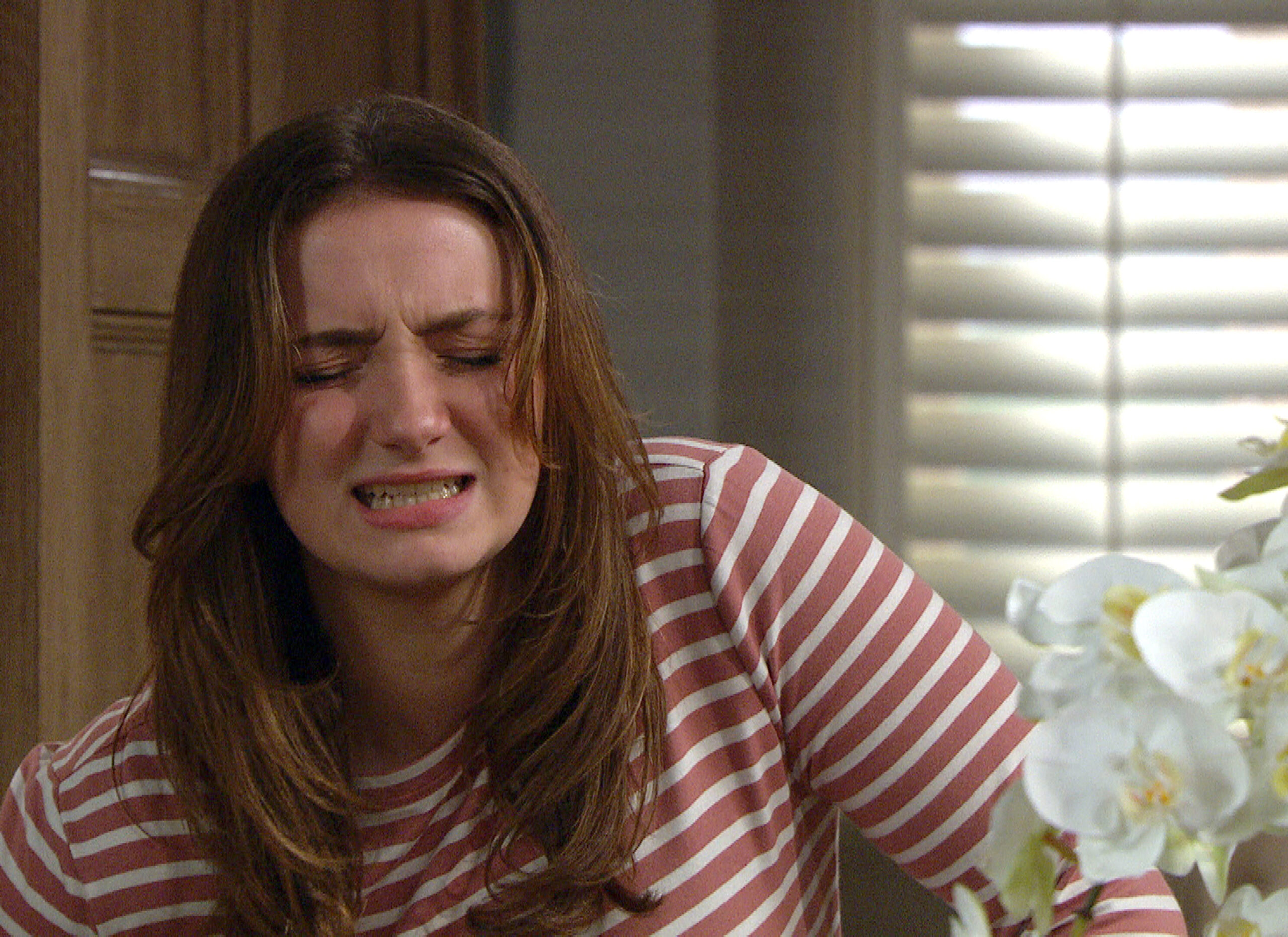 Gabby Allen doubles up in pain as she confronts Jamie in Emmerdale