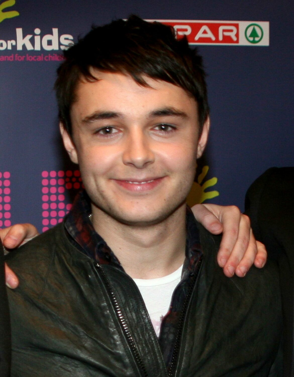 The X Factor cancelled: Leon Jackosn smiles at red carpet event