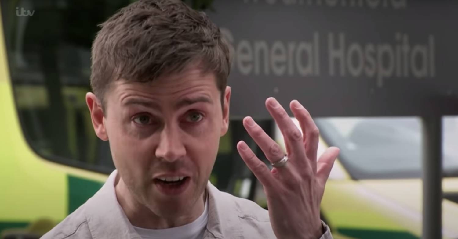 Corrie's Todd holds up his hand to show he is still wearing his ring