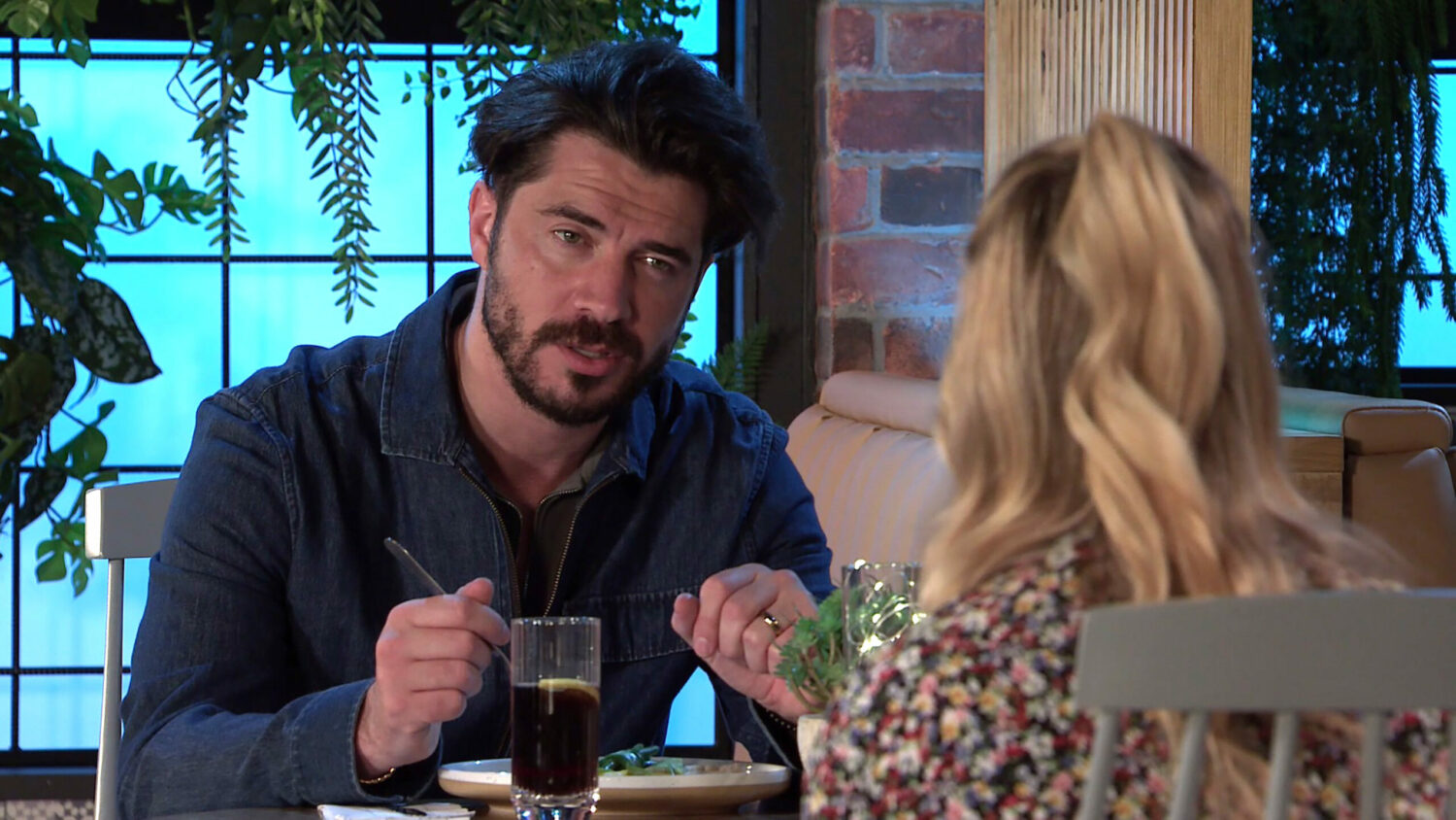 Coronation Street Adam talks to Sarah looking serious 