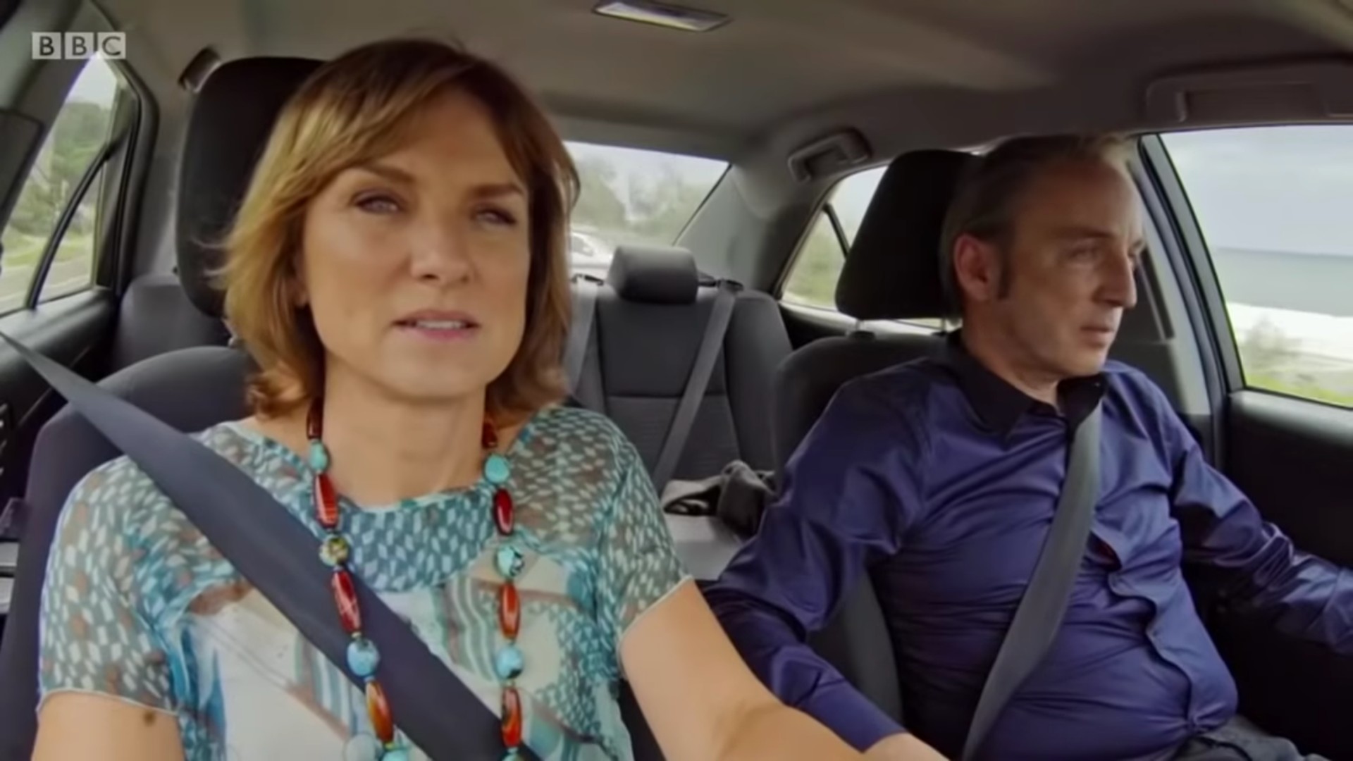 Fiona Bruce and Phillip Mould in a car on their show Fake Or Fortune
