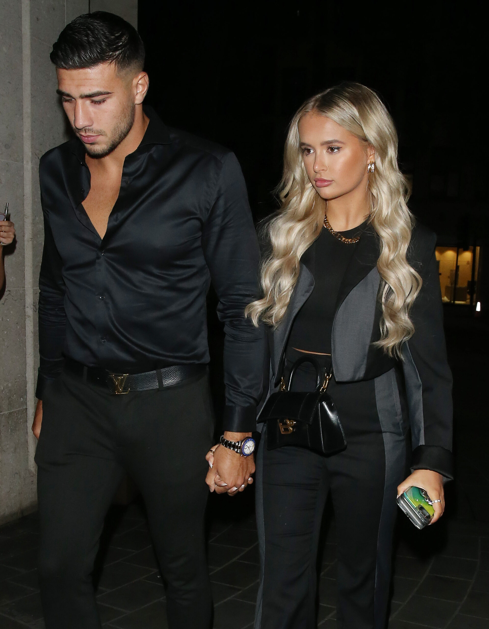 Love Island stars Molly-Mae Hague and Tommy Fury holding hands on a night out