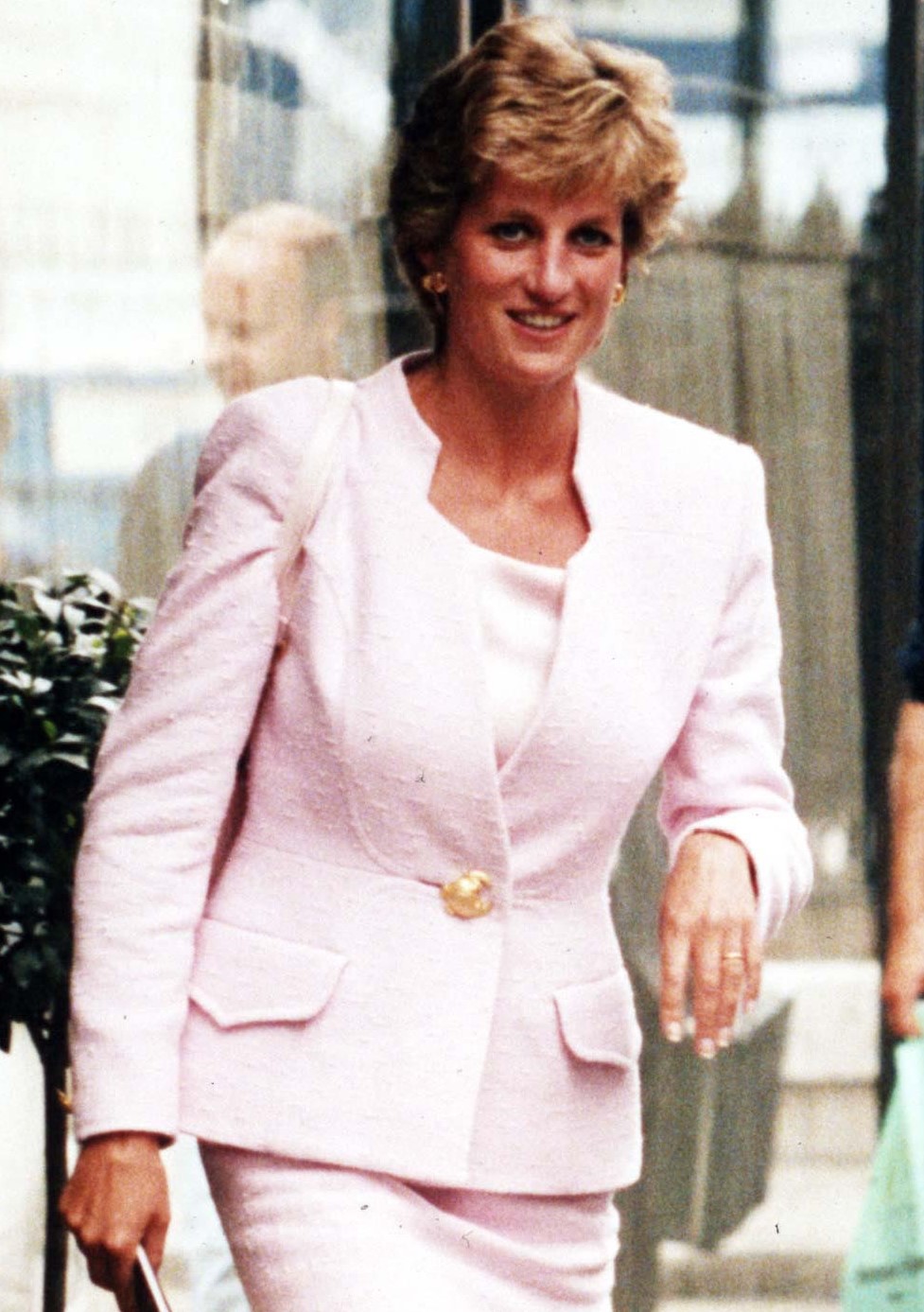 Princess Diana smiles as she steps out in front of cameras