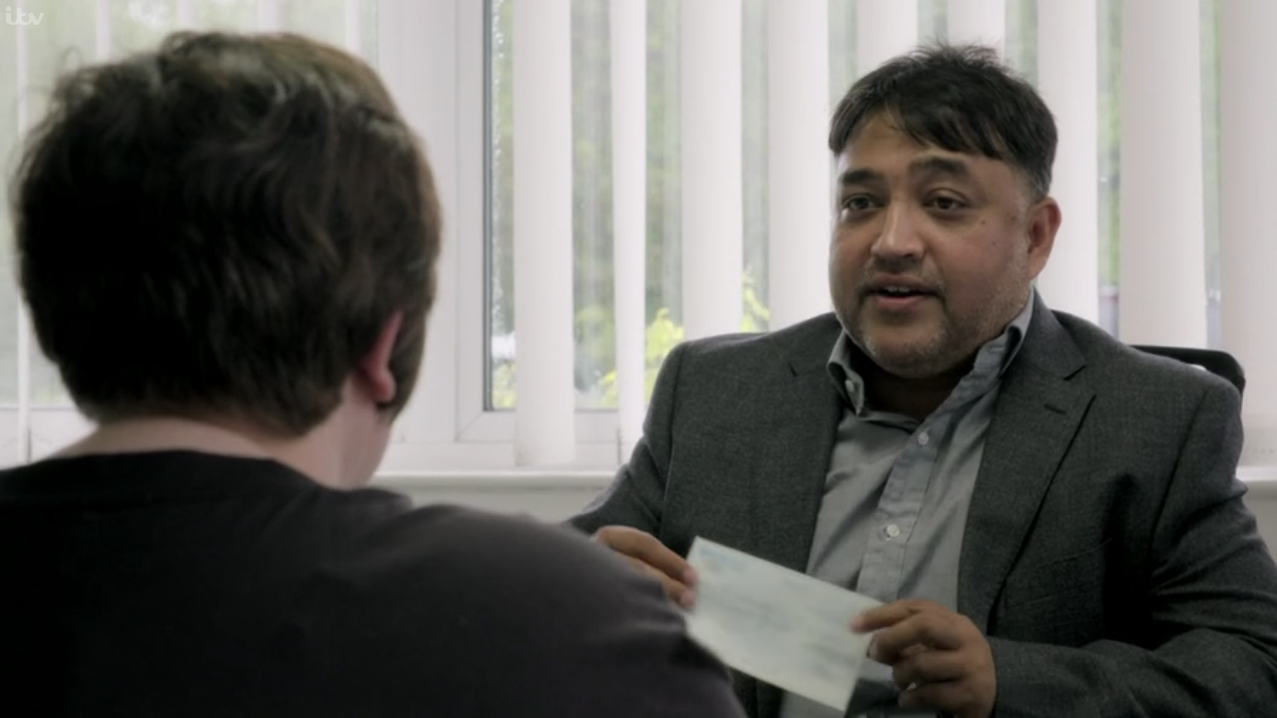 Shelim Euro foods boss presents employee Jess with £5000 cheque 