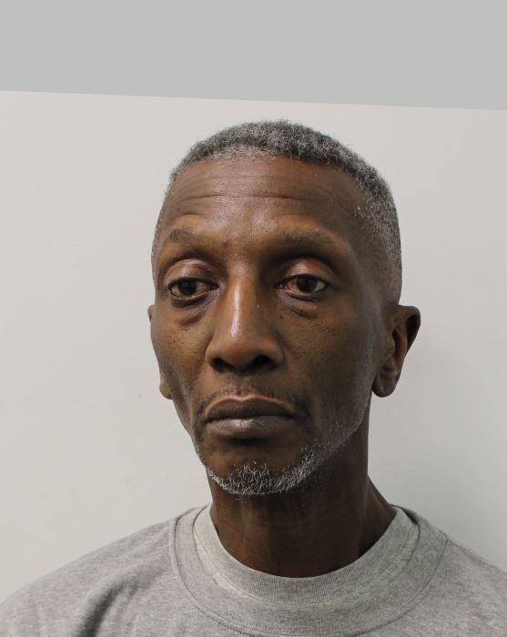 Gladiators Shadow aka Michael Jefferson King wears a grey sweatshirt in police mugshot