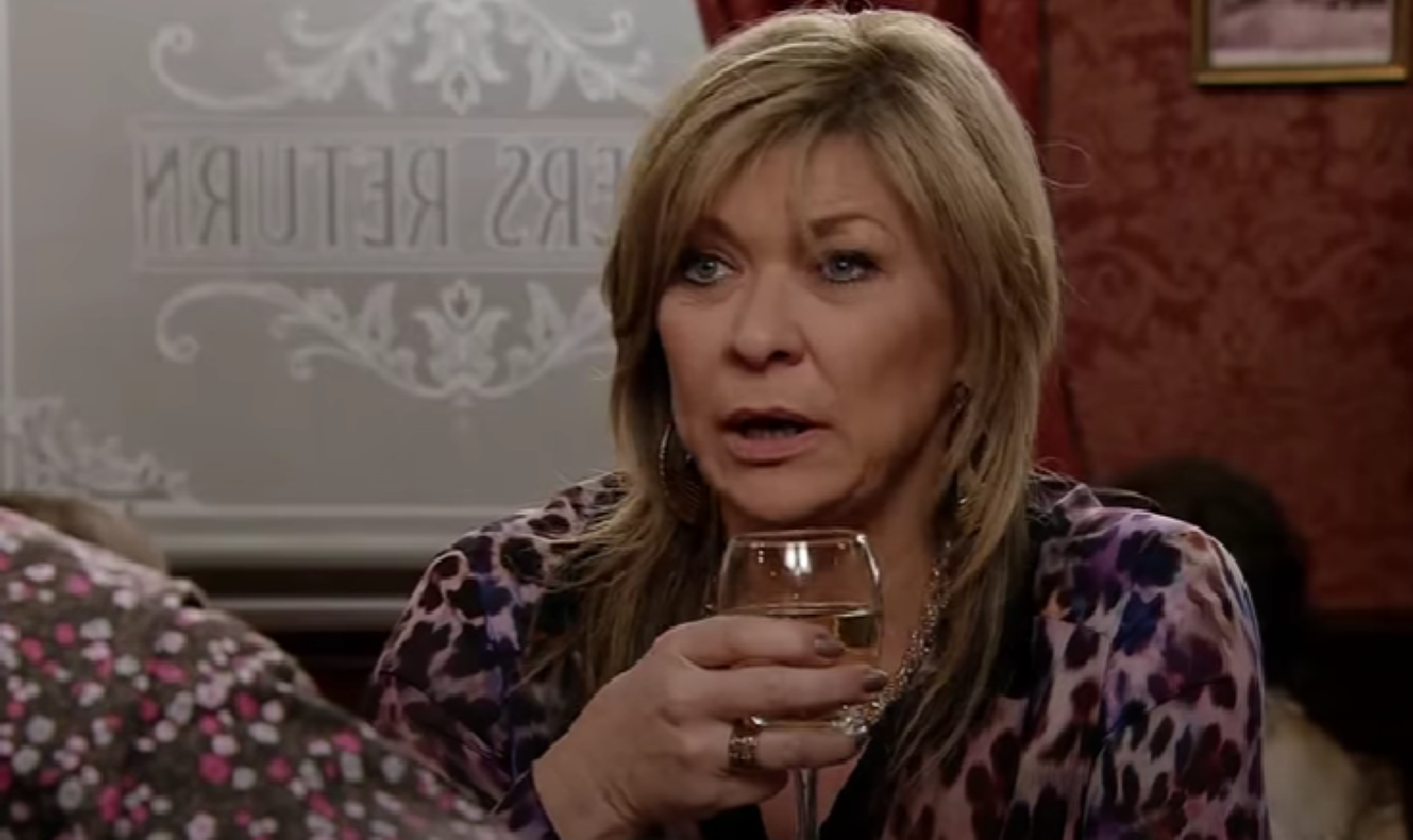 Erica with a glass of wine in Corrie 