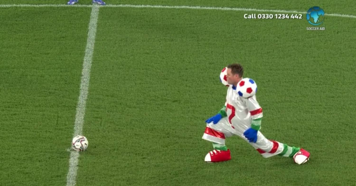 Stephen Mulhern warms up with a lunge for Soccer Aid