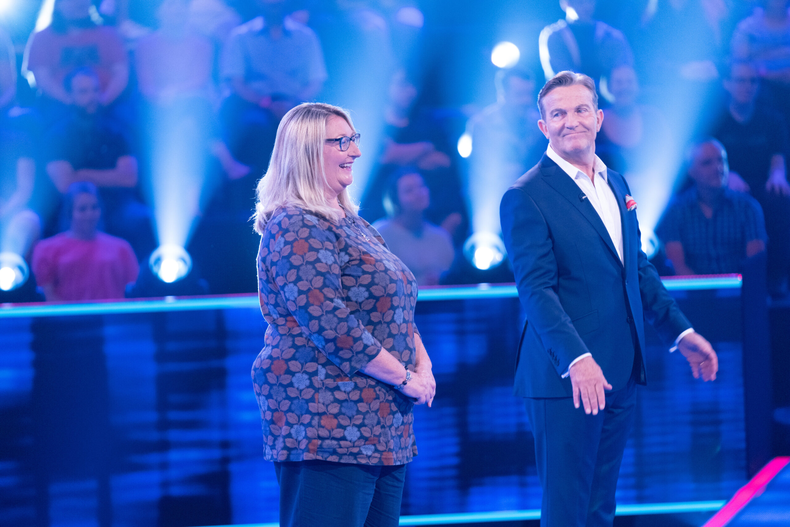 Bradley Walsh stands with a contestant on Beat the Chasers