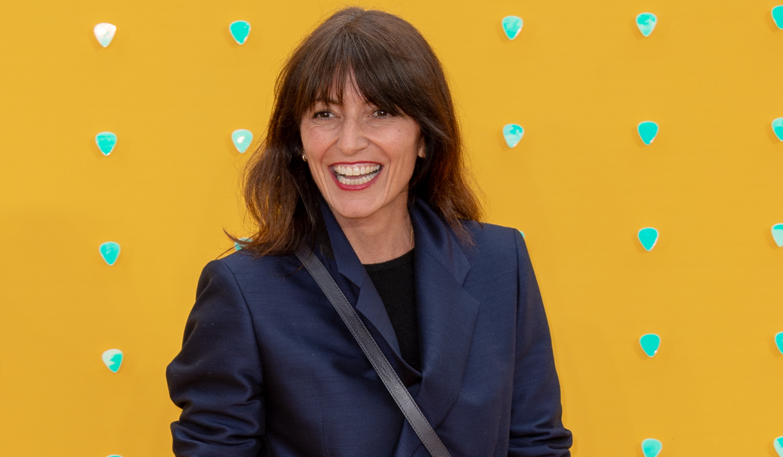 Davina McCall smiles on the red carpet