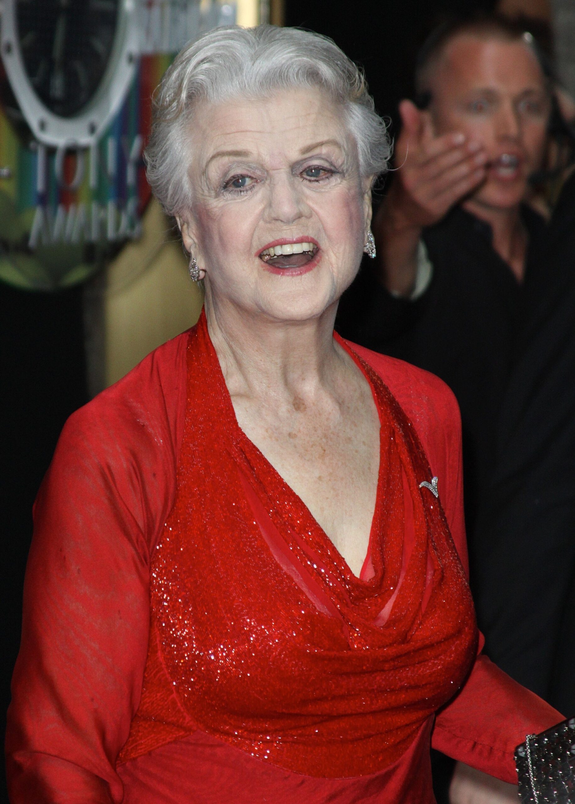 Angela Lansbury smiling in red dress