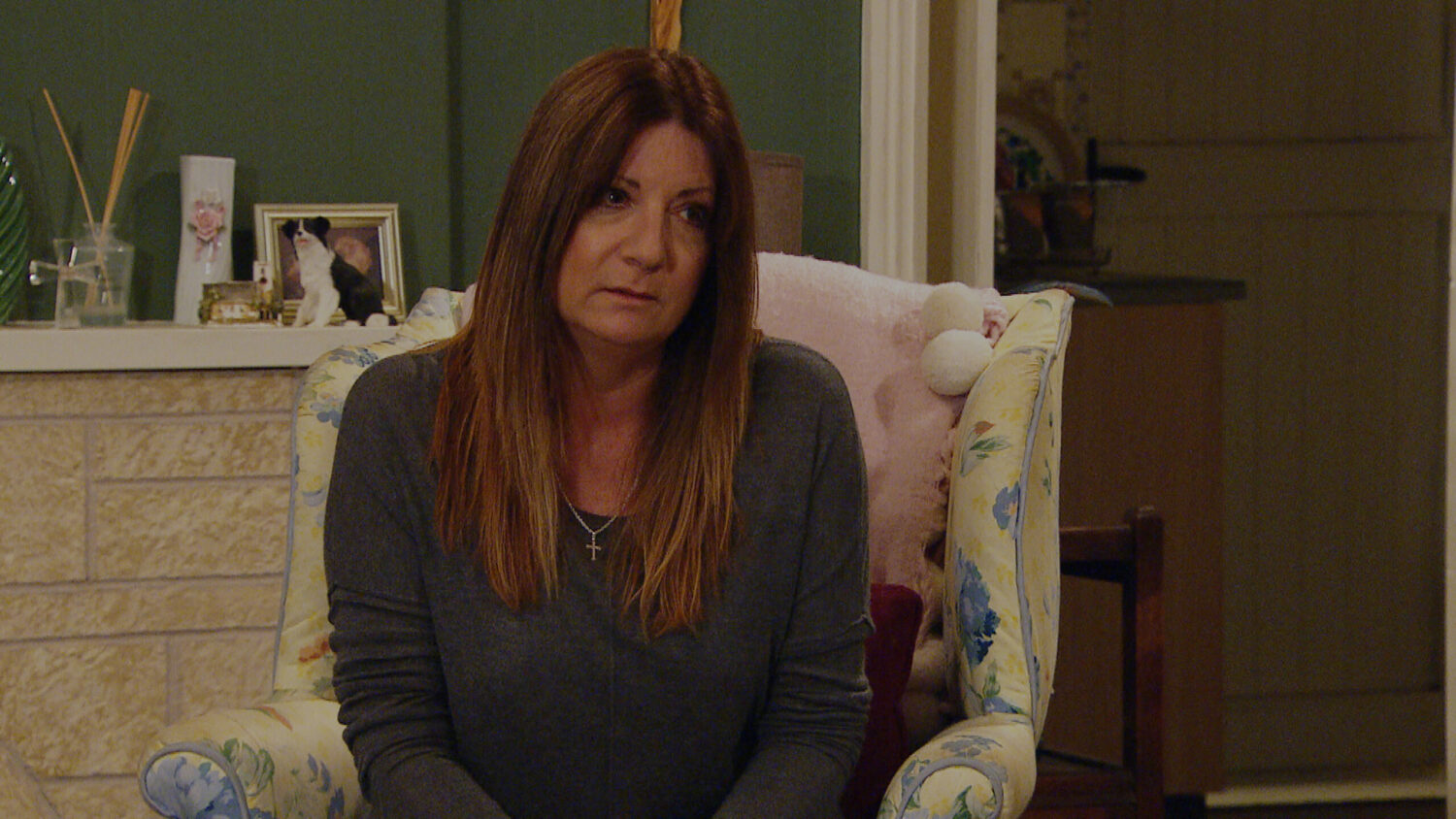 Emmerdale Harriet looks concerned in her living room