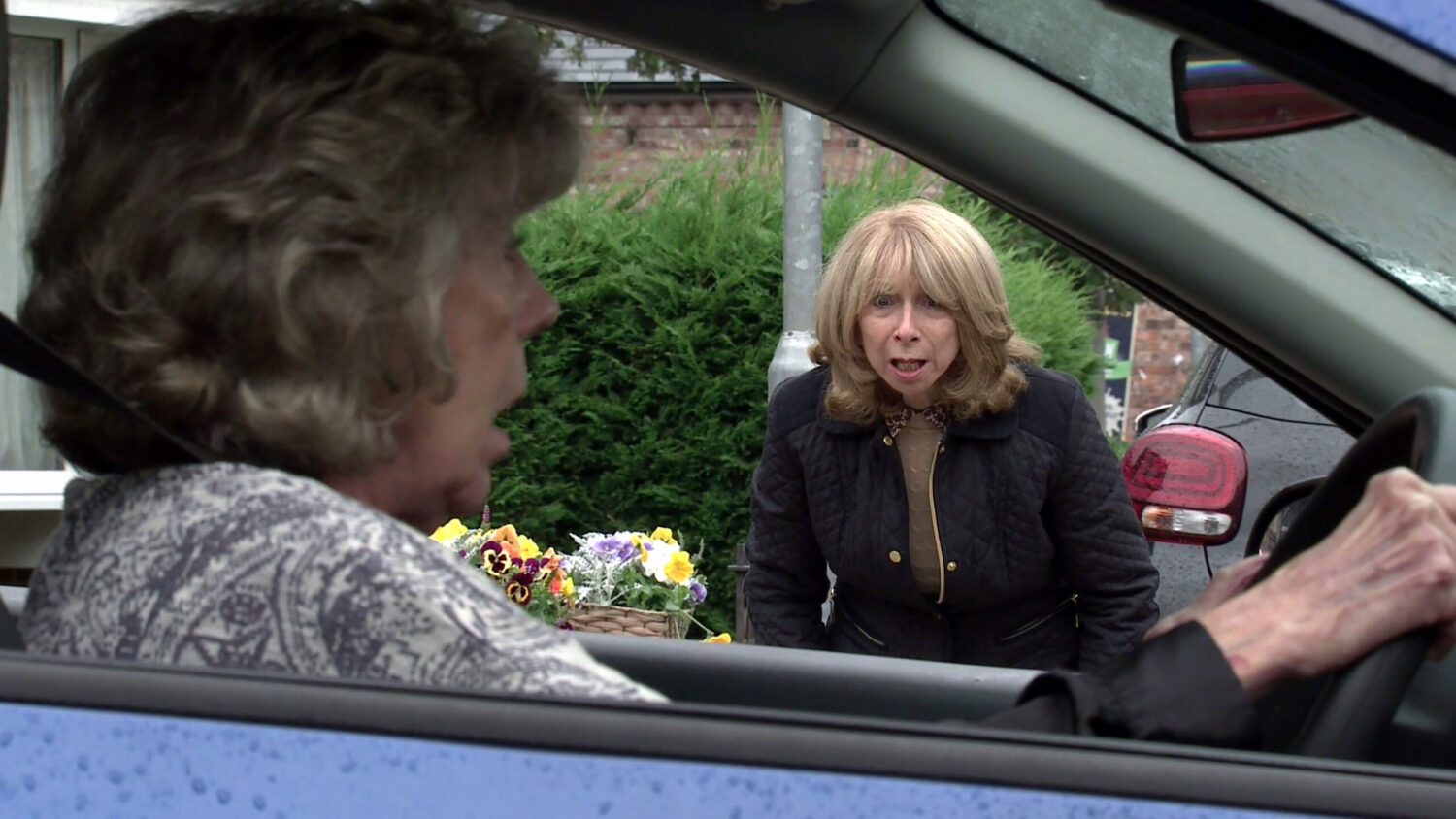 Coronation Street Audrey driving car as Gail watches on