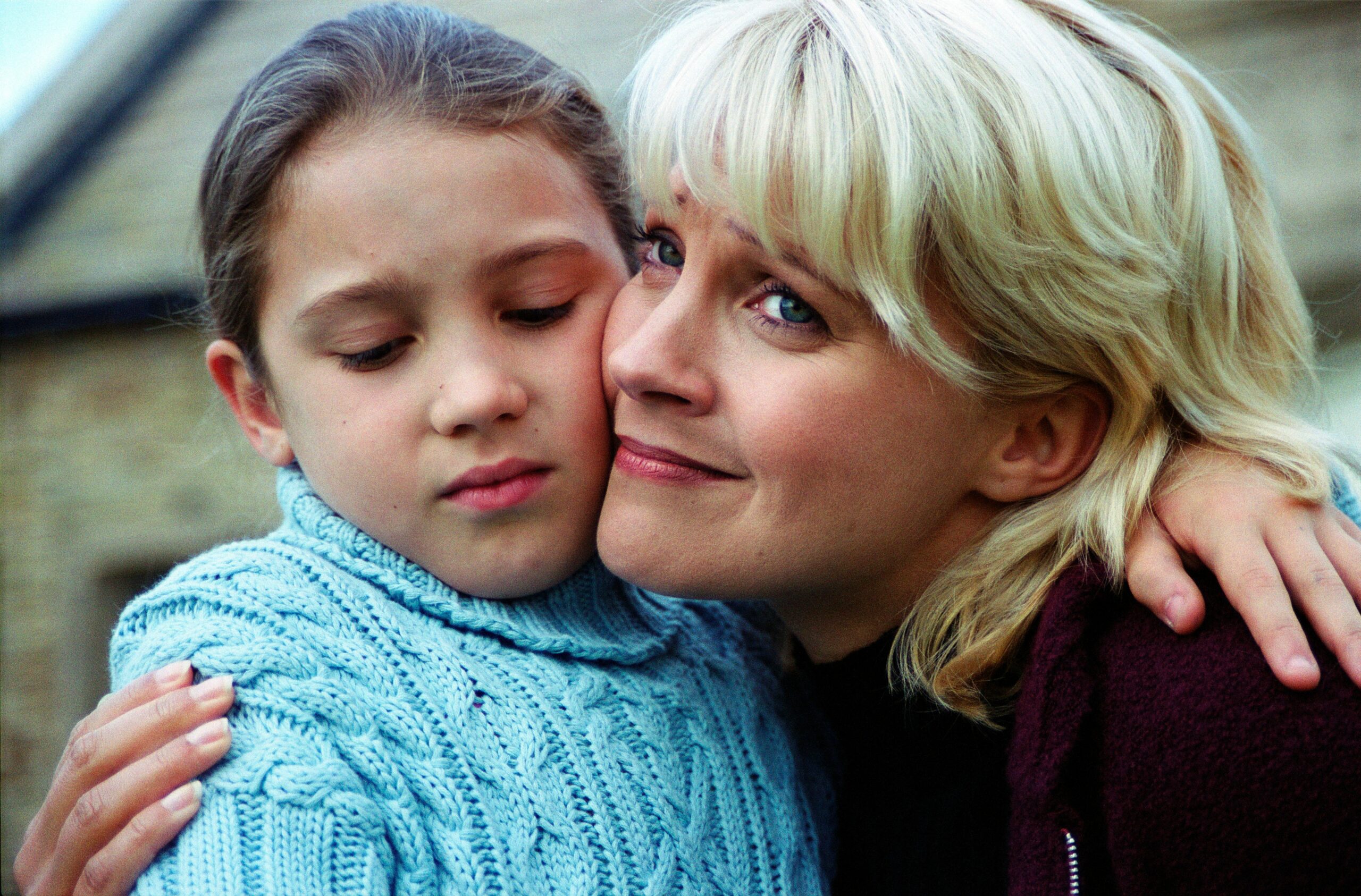 Alice Bates looks uncomfortable as her aunt Kathy Glover hugs her in Emmerdale