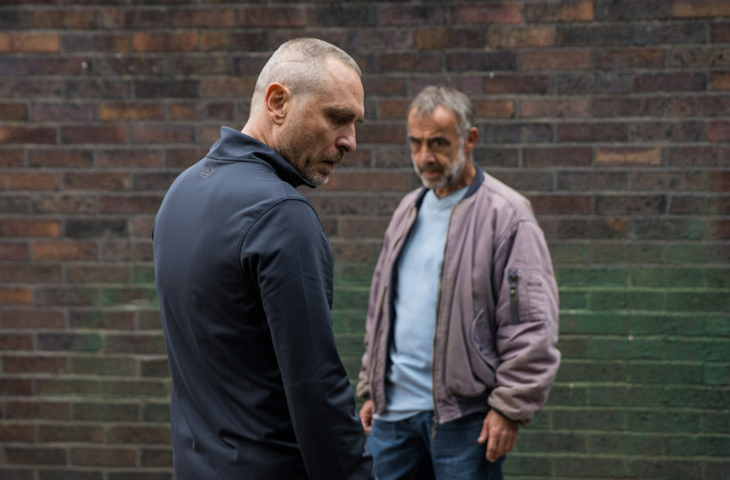 Tez looks suspicious as Kevin looks angry in Coronation Street